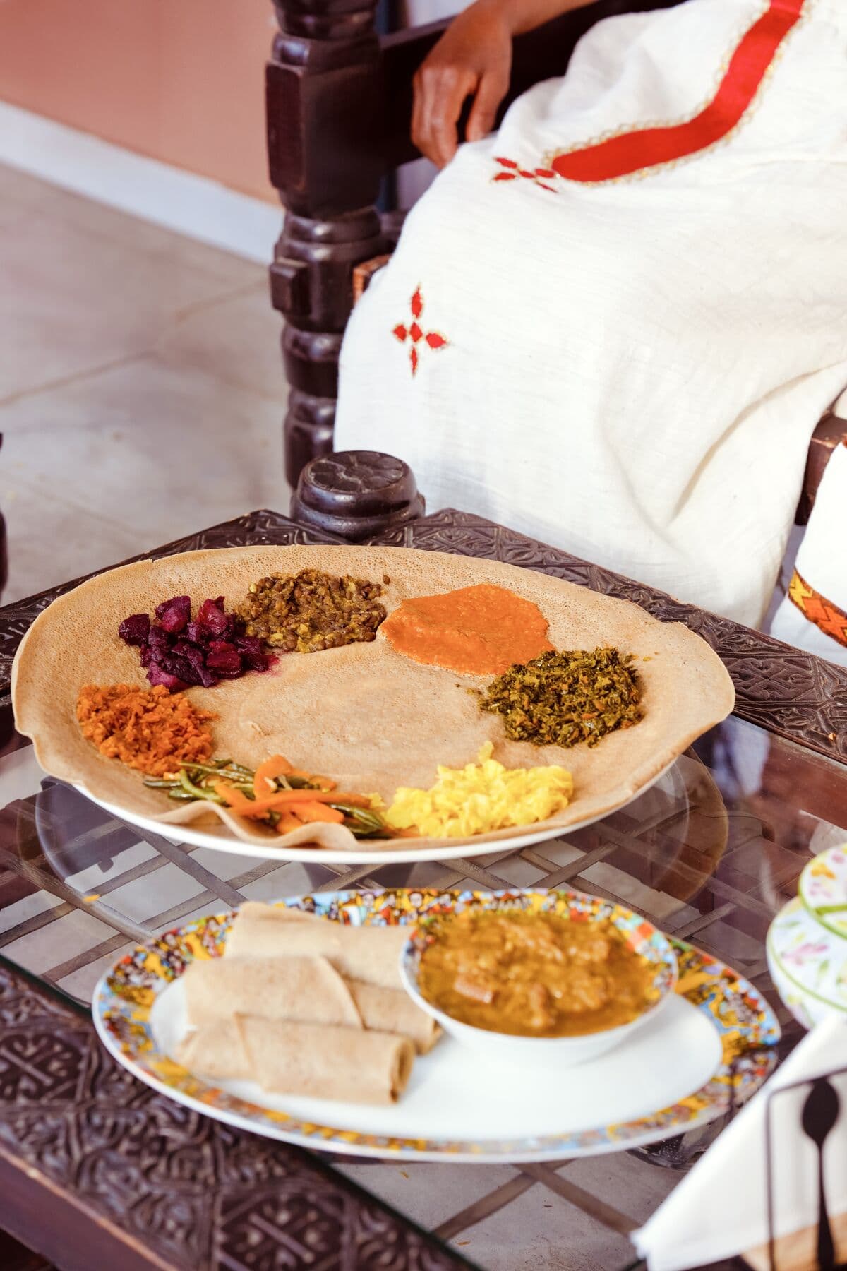 Beyaynetu served on a large injera platter at ge'eza