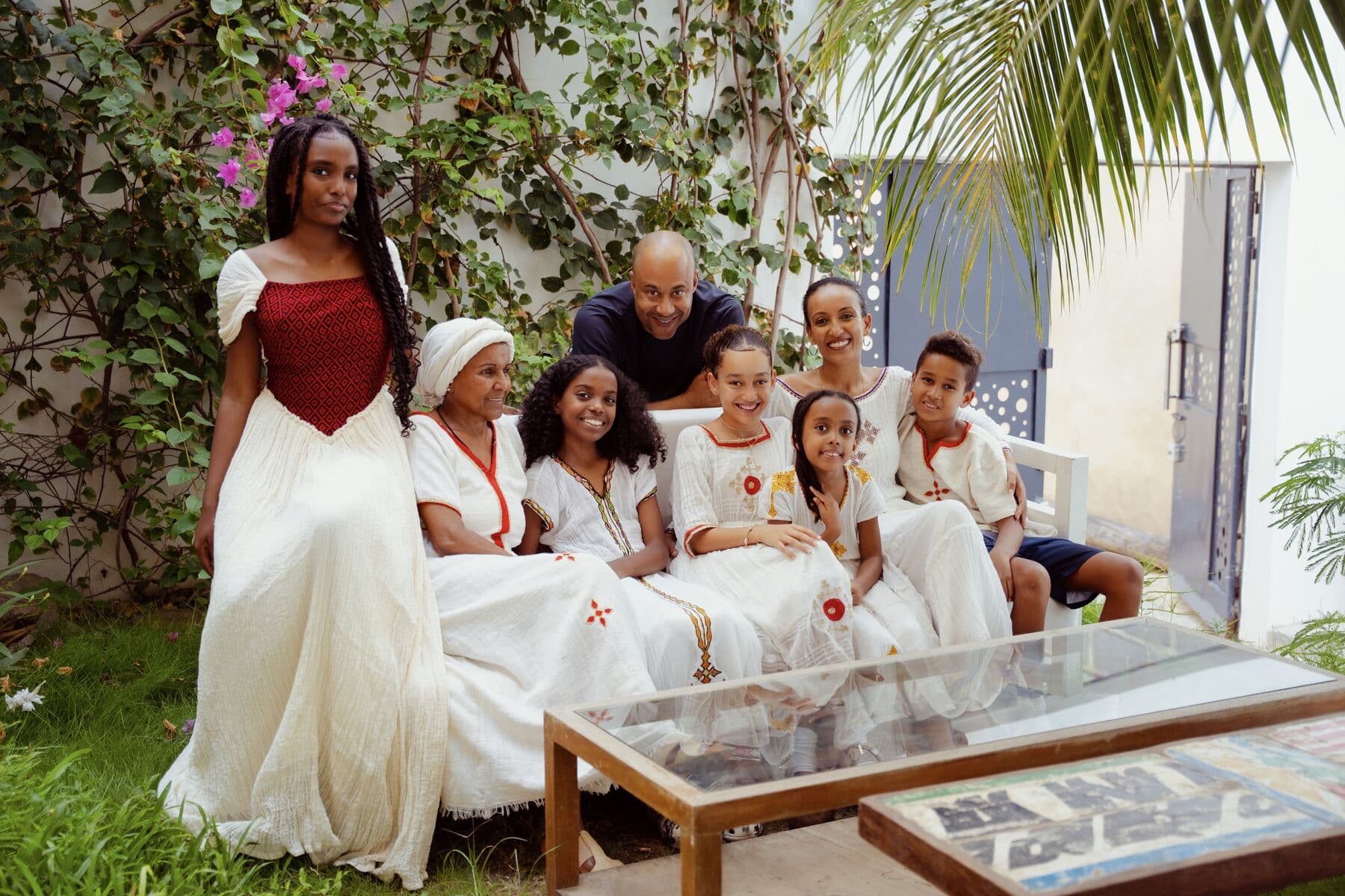 A family gathered in the garden of the ge'eza villa in Point E, Dakar